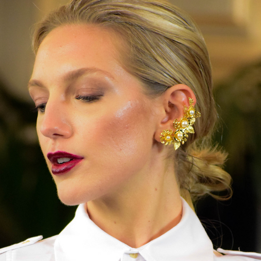 Woman wearing Amelia gold-plated earrings with freshwater pearls and crystal zirconia stones
