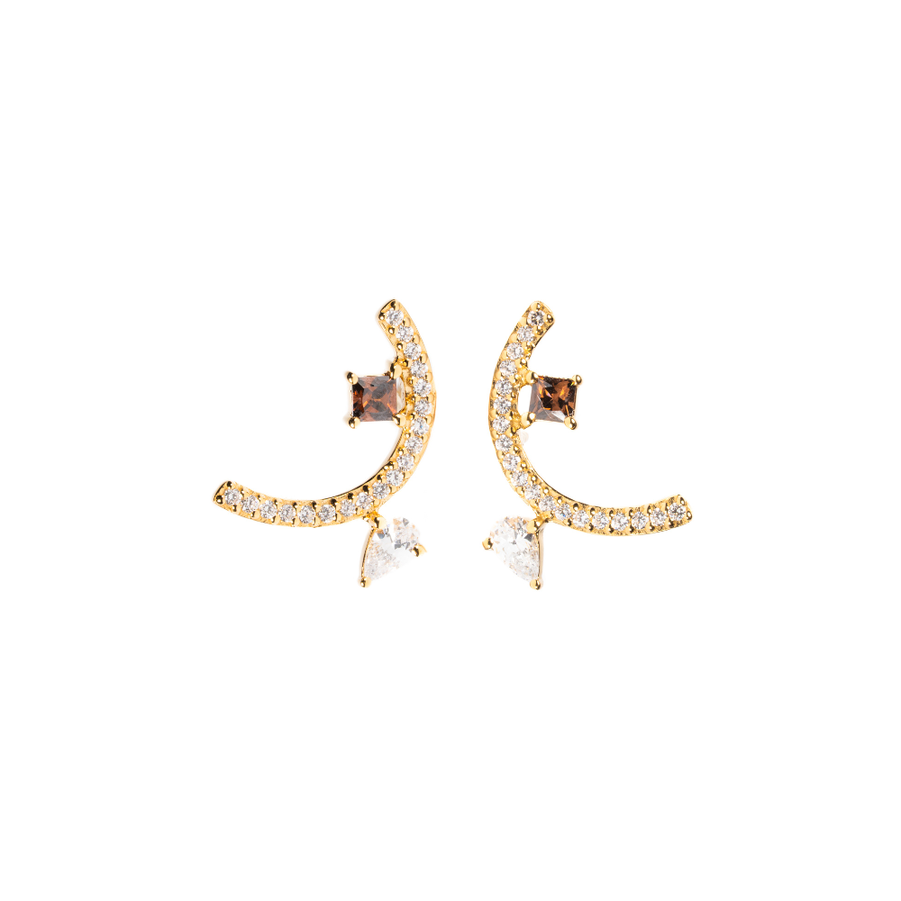Pair of gold earrings with gemstones on a white background