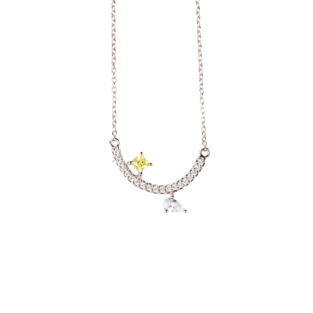 Necklace with a yellow and clear pendant on a white background