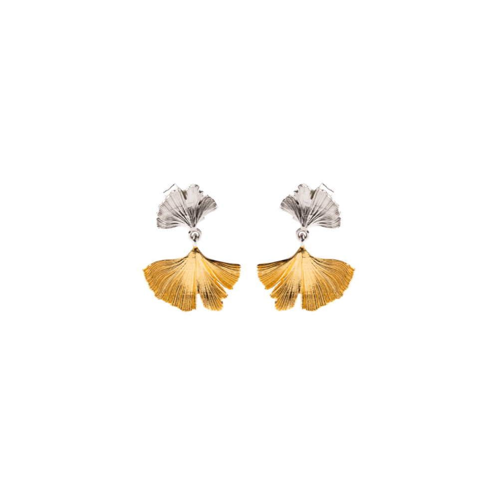 Pair of earrings with gold and silver leaf-like designs on a white background