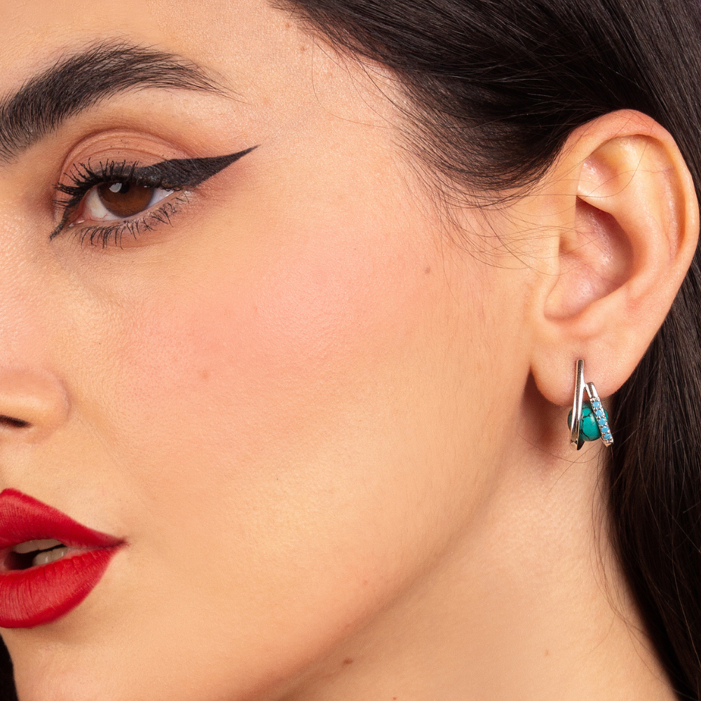 Woman wearing sterling silver Imara earrings with turquoise nano stones and turquoise gemstone